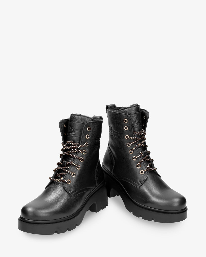 Porty botas de piel con forro interior de pelo. negro